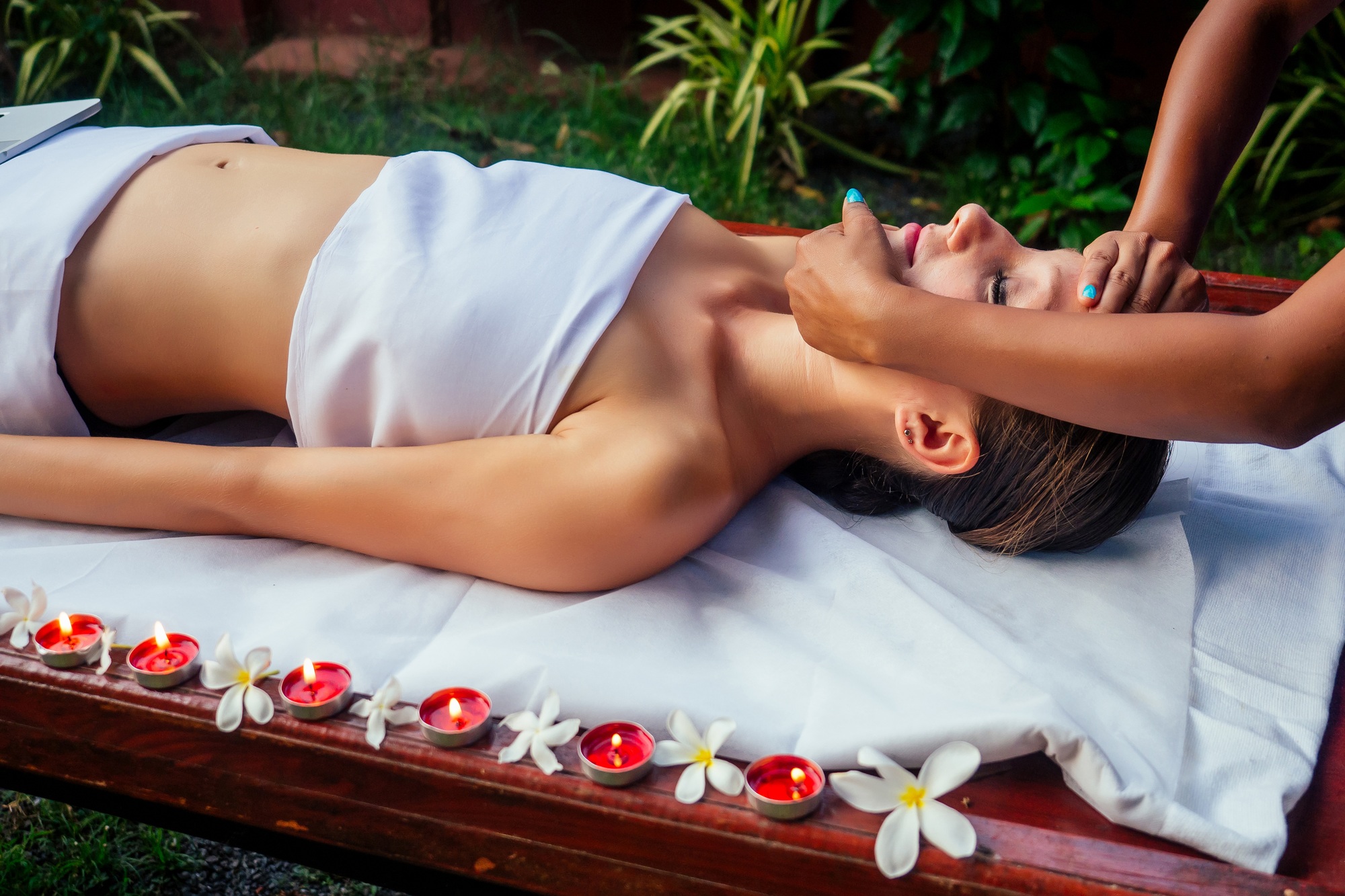 Woman having ayurveda spa treatment in asia salon head,